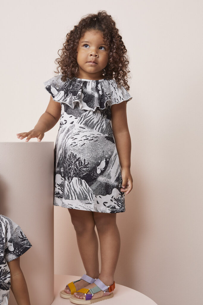 Child with papu design dress