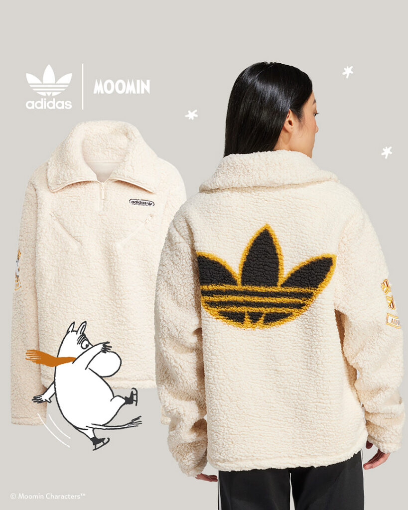 Woman wearing beige adidas pile jacket and a moomintroll ice skating